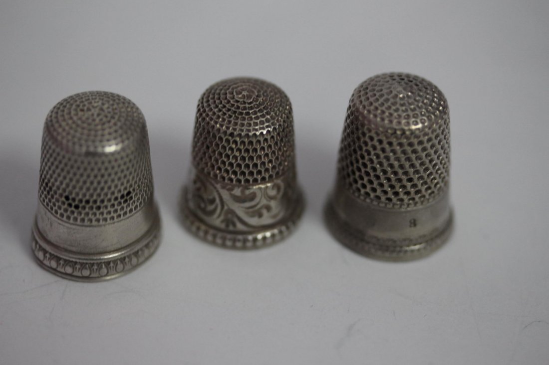 THREE ANTIQUE STERLING SILVER THIMBLES: THREE ANTIQUE STERLING SILVER THIMBLES