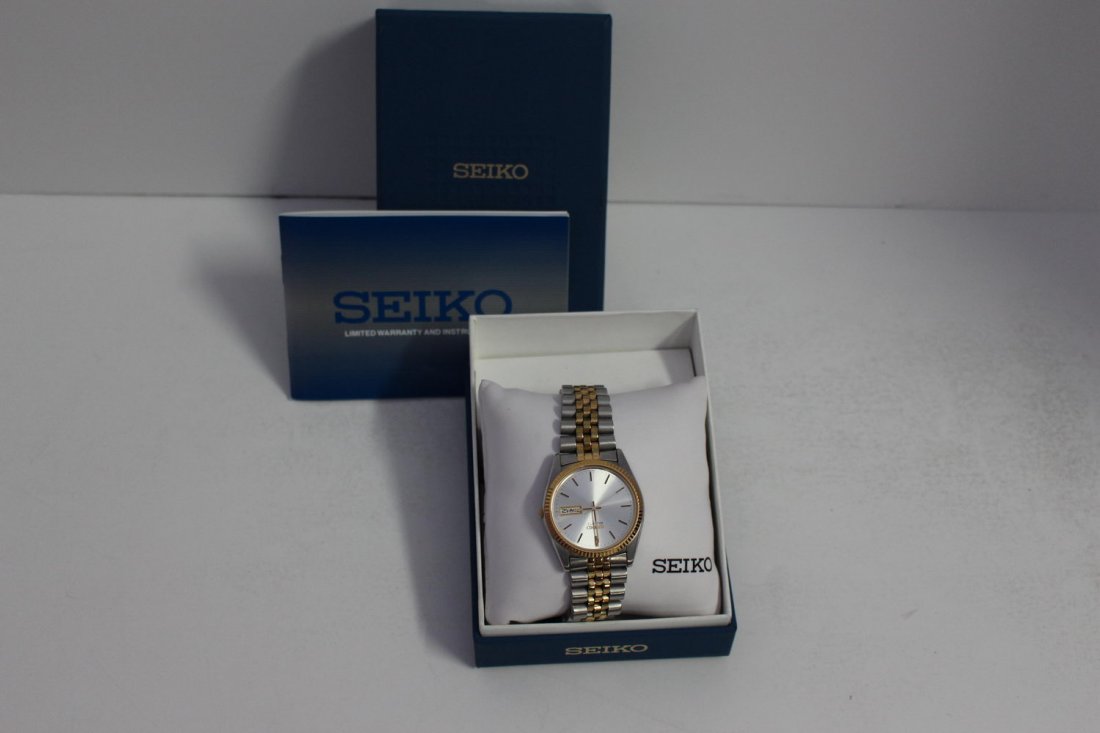 SEIKO NEW IN BOX MEN'S TIME AND DATE WRISTWATCH: SEIKO NEW IN BOX MEN'S TIME AND DATE WRISTWATCH STAINLESS STEEL AND GOLDTONE RETAIL $285