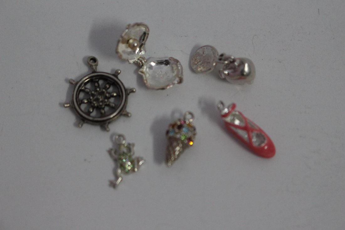 SIX STERLING SILVER CHARMS - PIGGY BANK- BALLERINA: SIX STERLING SILVER CHARMS - PIGGY BANK- BALLERINA SHOE- ICE CREAM CONE- OYSTER SHELL WITH PEARL- SHIPS WHEEL- FROG