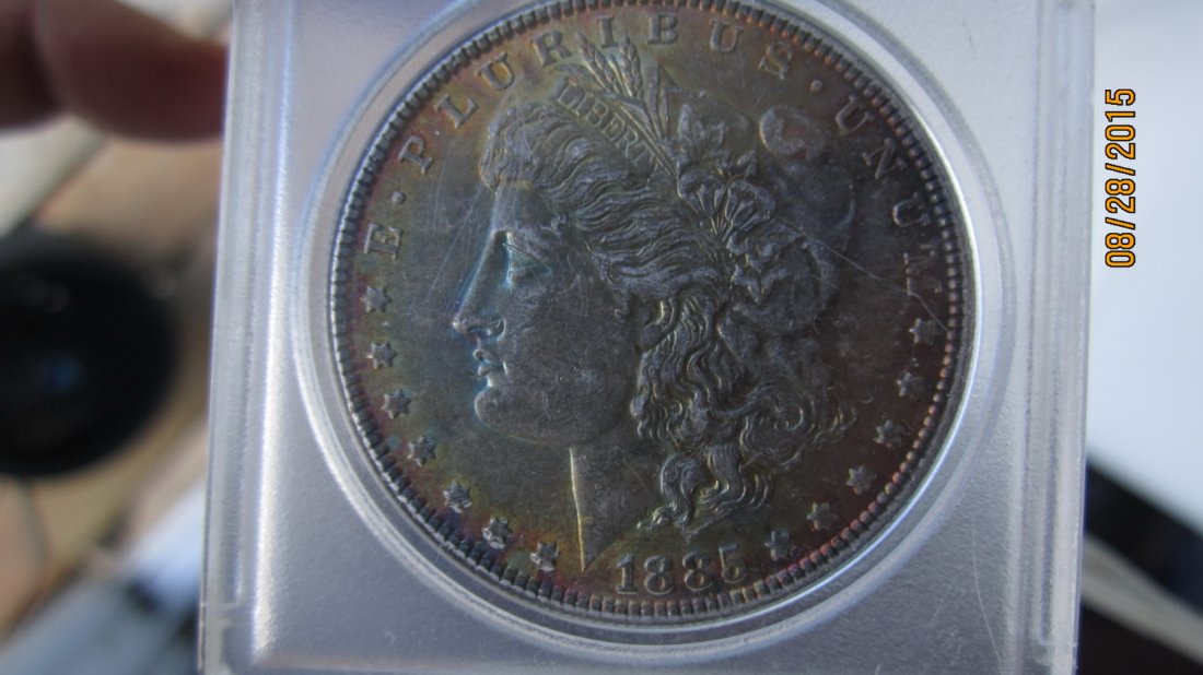 1885 US SILVER DOLLAR AU. CONDITION GOOD BREAST (1 of 2)
