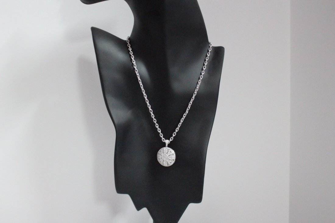 BRAND-NEW STERLING SILVER LOCKET FEATURING BRILLIANT CZ: BRAND-NEW STERLING SILVER LOCKET FEATURING BRILLIANT CZ GEMSTONES SUPPORTED BY A 18" ROPE CHAIN LINK NECKLACE