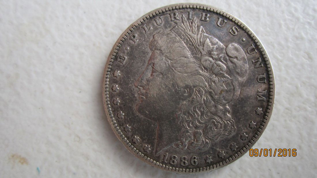 1886-O U.S.  SILVER DOLLAR - EX. FINE COND. (1 of 3)