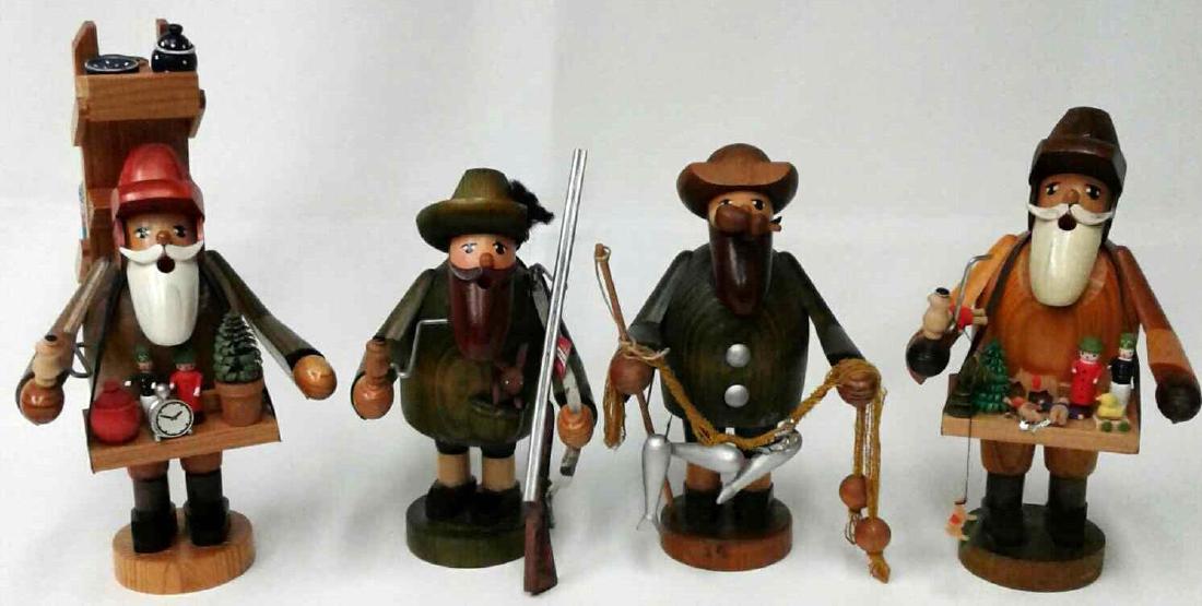 Collection of Four German Wooden Smokers to Include One: Collection of Four German Wooden Smokers to Include One Peddler Salesman 8 1/2", One Hunter Smoker 6", One Fisherman 6", and One Toy Salesman 7". Made In Germany