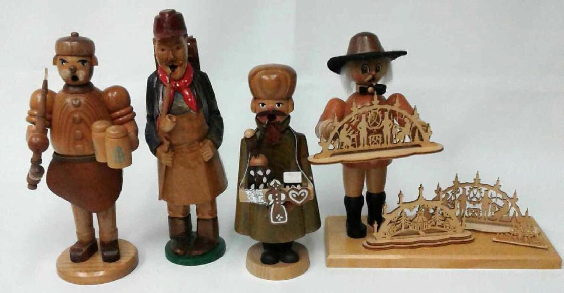 Collection of Four German Wooden Smokers to Include One: Collection of Four German Wooden Smokers to Include One Echt Erzgebirge Beer Drinking Smoker 8", One Wanderer Smoker 9", One Bakery Salesman Smoker 7", and One Erzgebirge Explorer Smoker 8". Made in G