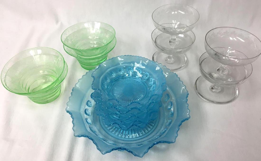 Collection of Depression Glass To Include Ruffled Blue: Collection of Depression Glass To Include Ruffled Blue Bowl with Five Complementing Berry Bowls, Four Etched Champagne Glasses, Four Green Etched Dessert Bowls on a Wicker Tray