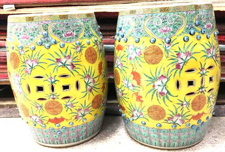 Chinese Porcelain Mid 19th Century Garden Seats: Pair of Chinese Famille Jaune Porcelain Garden Seats. Barrel-shaped with blue studding, imperial yellow ground with turquoise border and pink peonies with clusters of fruits and leaves. Base with