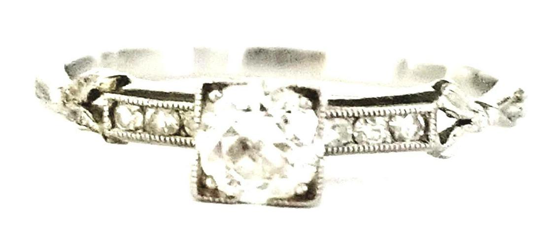 Antique Platinum Diamond Engagement Ring: Antique Platinum Diamond Engagement Ring. With One Old European Cut Diamond Weighing Approx. 20cts and 6 Round Cut Brilliant Diamonds. 