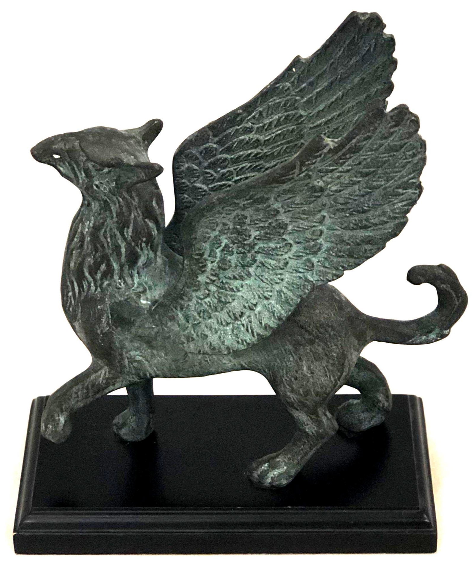 Bronze Griffin Statue: Bronze Griffin Statue. Fastened to Wooden Base, with Felt on Bottom. In Excellent Condition, Measuring 7 1/2" in Height and Approx. 6 1/2" in Length.