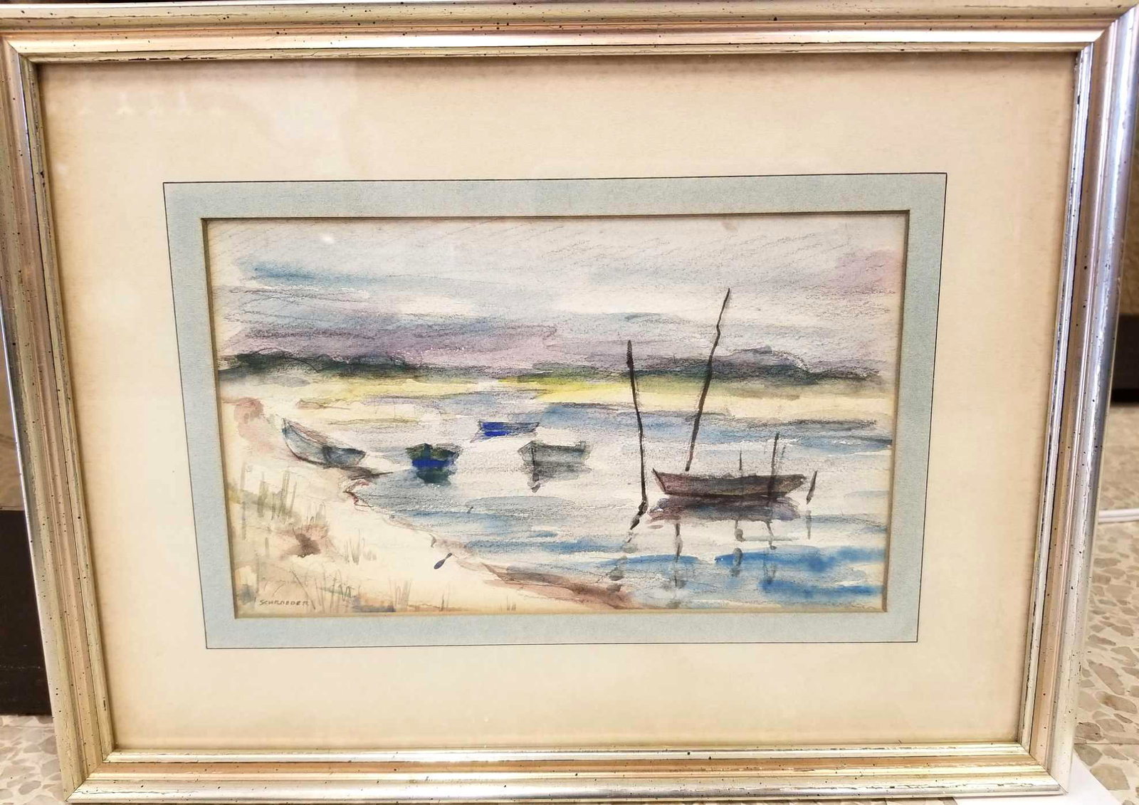 Boats by the Shore Watercolor by Howard Schroeder: Boats by the Shore Watercolor by Howard Schroeder. To Include One Watercolor Painting, In Excellent Condition. Measures 11 3/4"x 8 3/4" Framed. Signed Bottom Left. Howard Stephen Schroeder was bo