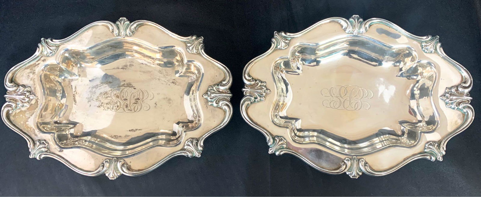 Pair Baily Banks & Biddle Sterling Oval Dishes: Pair of Sterling Oval Dishes with Foliate Rims and Engraved Initials by Bailey, Banks & Biddle Co. Measuring 9 3/4" in Length Each, Weighing 17 Troy oz. Combined. In Good Condition.