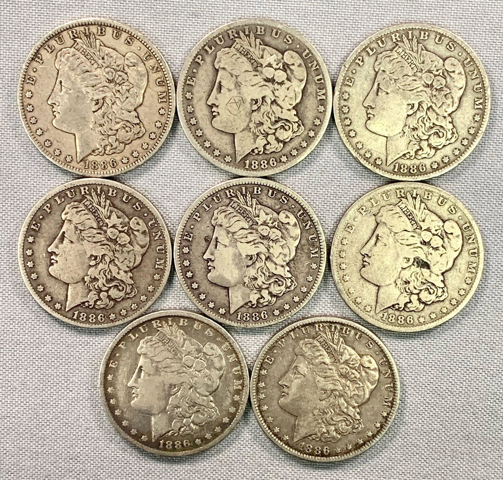 Eight 1886-O Morgan Silver Dollars (1 of 4)