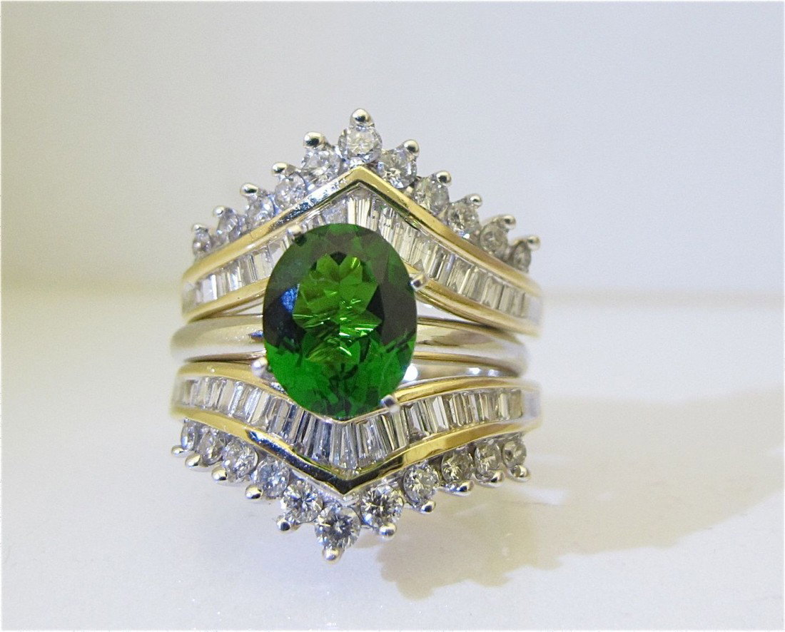 14KYG Tsavorite and Diamond Ring Containing 1 Oval: 14KYG Tsavorite and Diamond Ring Containing 1 Oval Tsavorite=3cts., 14K Frame Containing 22Br=.50cts., 44Bag=1.20cts., 6.83dwt