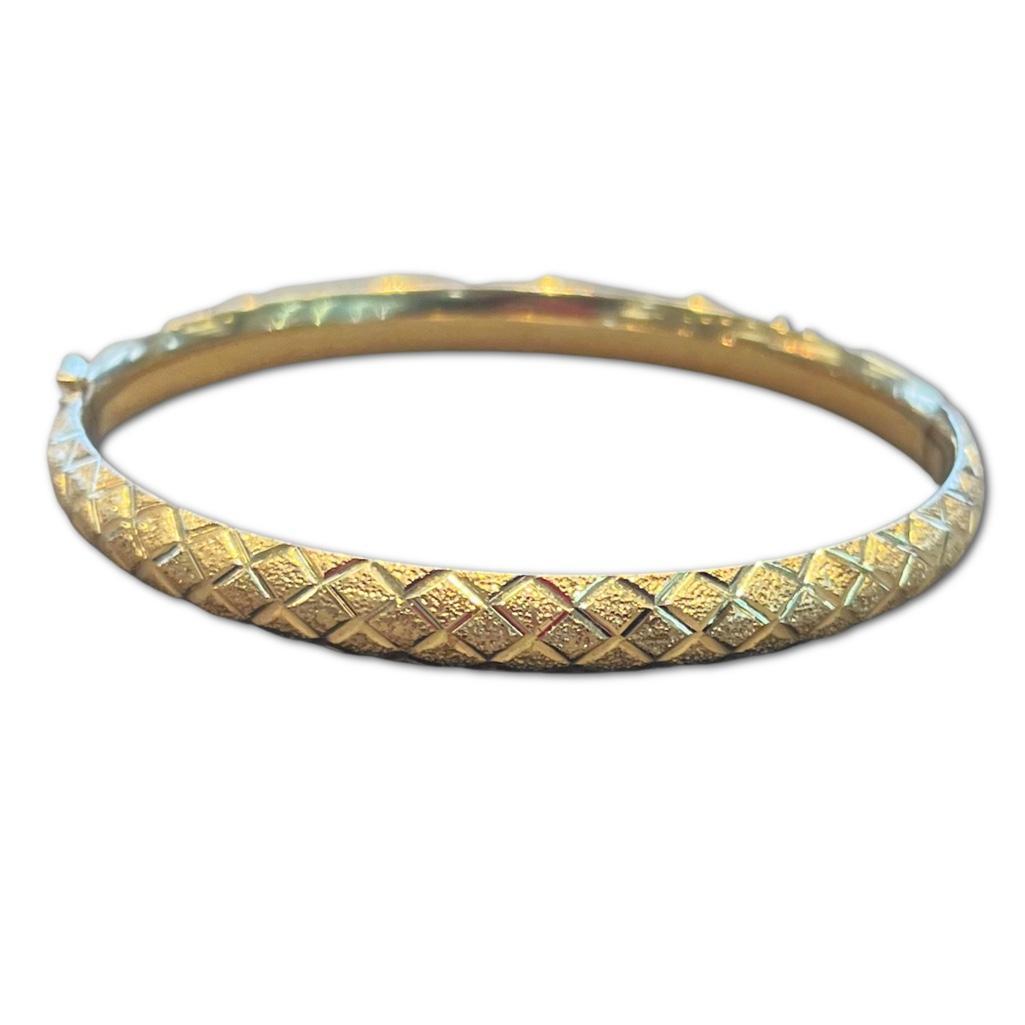 14k Yellow Gold Bangle: 14k Yellow Gold Bangle with Cross Hatch Design. The Bangle is approximately 2.5 inches in diameter and features a tube lock clasp. Bangle weight 4.46dwt.