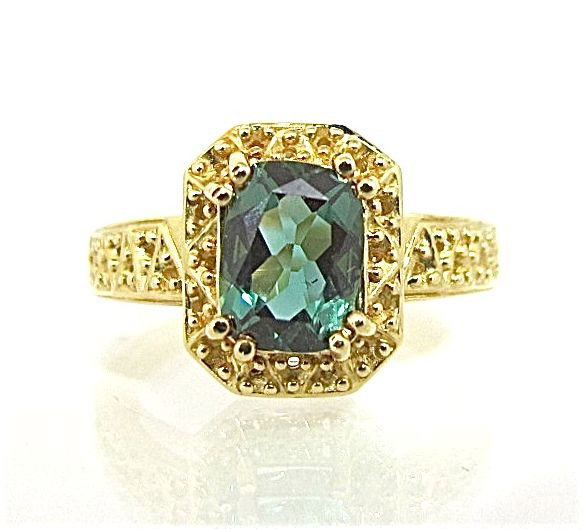 14K Yellow Gold & Green Tourmaline Ring Containing: 14K Yellow Gold & Green Tourmaline Ring Containing 1 Cushion Cut Green Tourmaline = approx 2.50cts., 3.91dwt