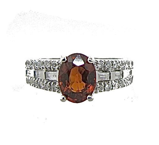 10K White Gold Mozambique Garnet & Diamond Ring: 10K White Gold Mozambique Garnet & Diamond Ring Containing 6 Baguette Diamonds=.12cts., 24 Round Diamonds=.24cts., 1 Oval Cut Garnet=approx 1.50cts., 3.15dwt