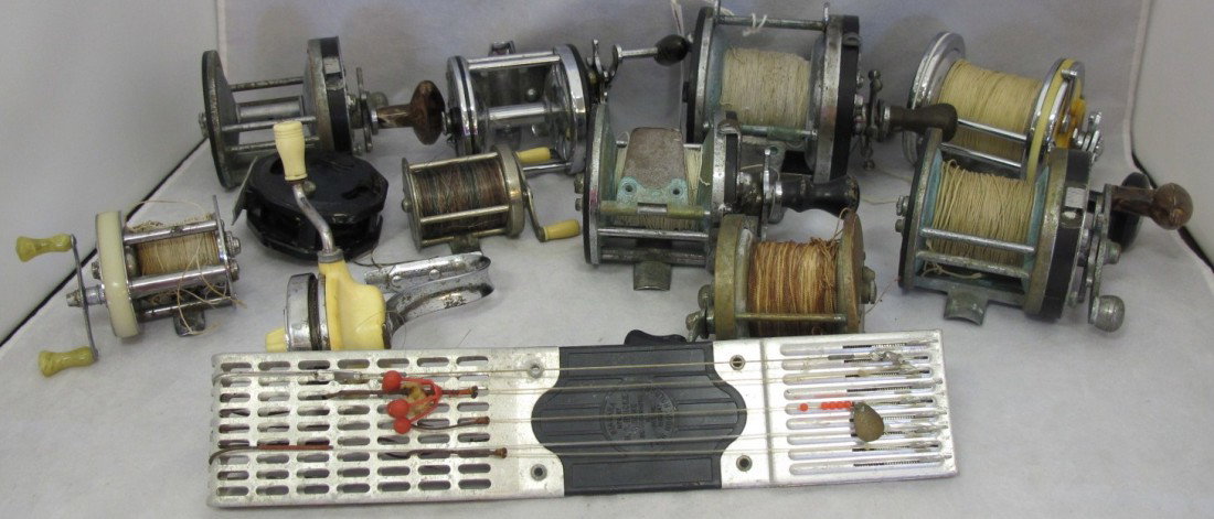 Collection of Vintage 11 Fishing Reels & Hooks: Pe: Collection of Vintage 11 Fishing Reels & Hooks: Penn Silver Beach #99; Union Hardware Company Tourington, CT; Vernly Trout Reel; Pair Pflueger Capital, Trademark #1988; Pflueger Templar 1419 3/4; Pflu