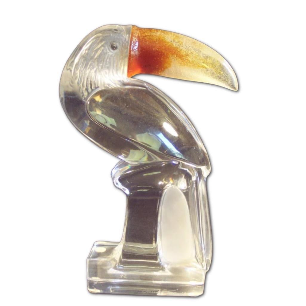 Stylized Crystal Toucan Sculpture by Daum, France: Stylized Crystal Toucan Sculpture by Daum, France, Stylized crystal toucan sculpture with amber beak by Daum France, circa 1980s. The etched signature reads "Daum France" and the sculpture is