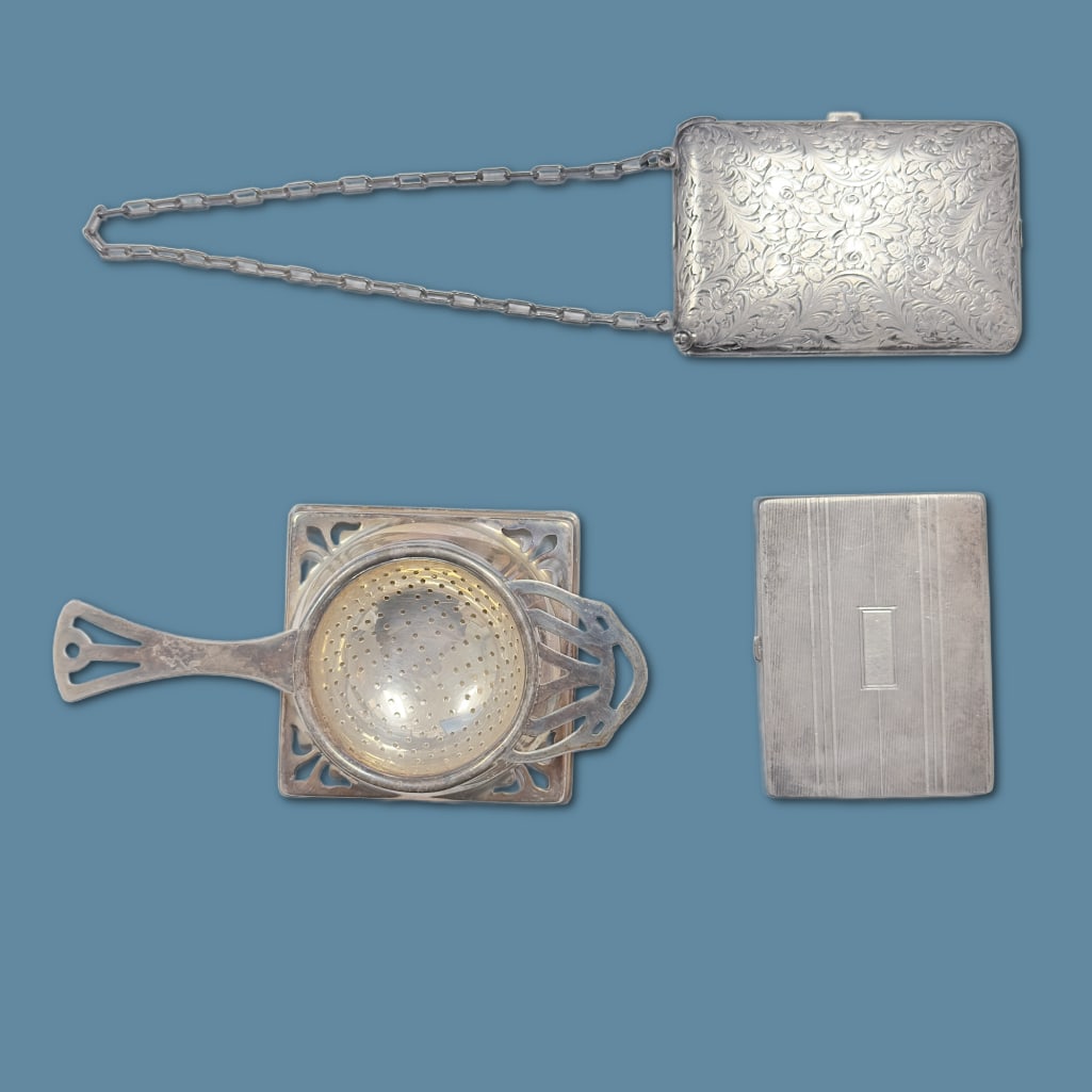 Collection of Antique Silver Plated Pieces: Collection of Antique Silver Plate. To include: One Tea Strainer w/ Base (3" sq base, 1 1/4" height, 5.5 length) One Sugar Shaker w/ Cobalt Base (approx 3" tall), One Powder Box w/ Mirror (2" x 3