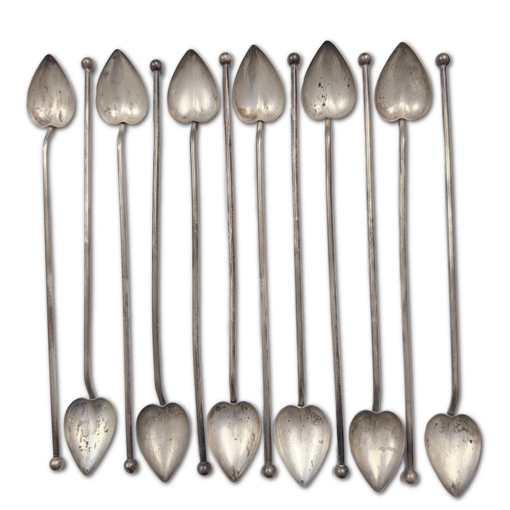 Twelve Mid-Century Cocktail Sipper Straws with Heart-Shaped Spoons: Mid-Century Cocktail Sipper Straws with Heart-Shaped Spoons Set of Twelve (12), 1950s. Measures 8 1/4" and weigh 4.5 troy ounces total. Stamped sterling with makers mark. 