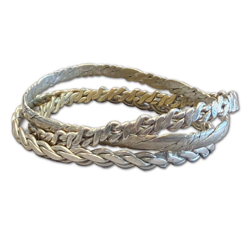 Three Silver Metal Bangles: Three Silver Metal Bangles, one possibly sterling.