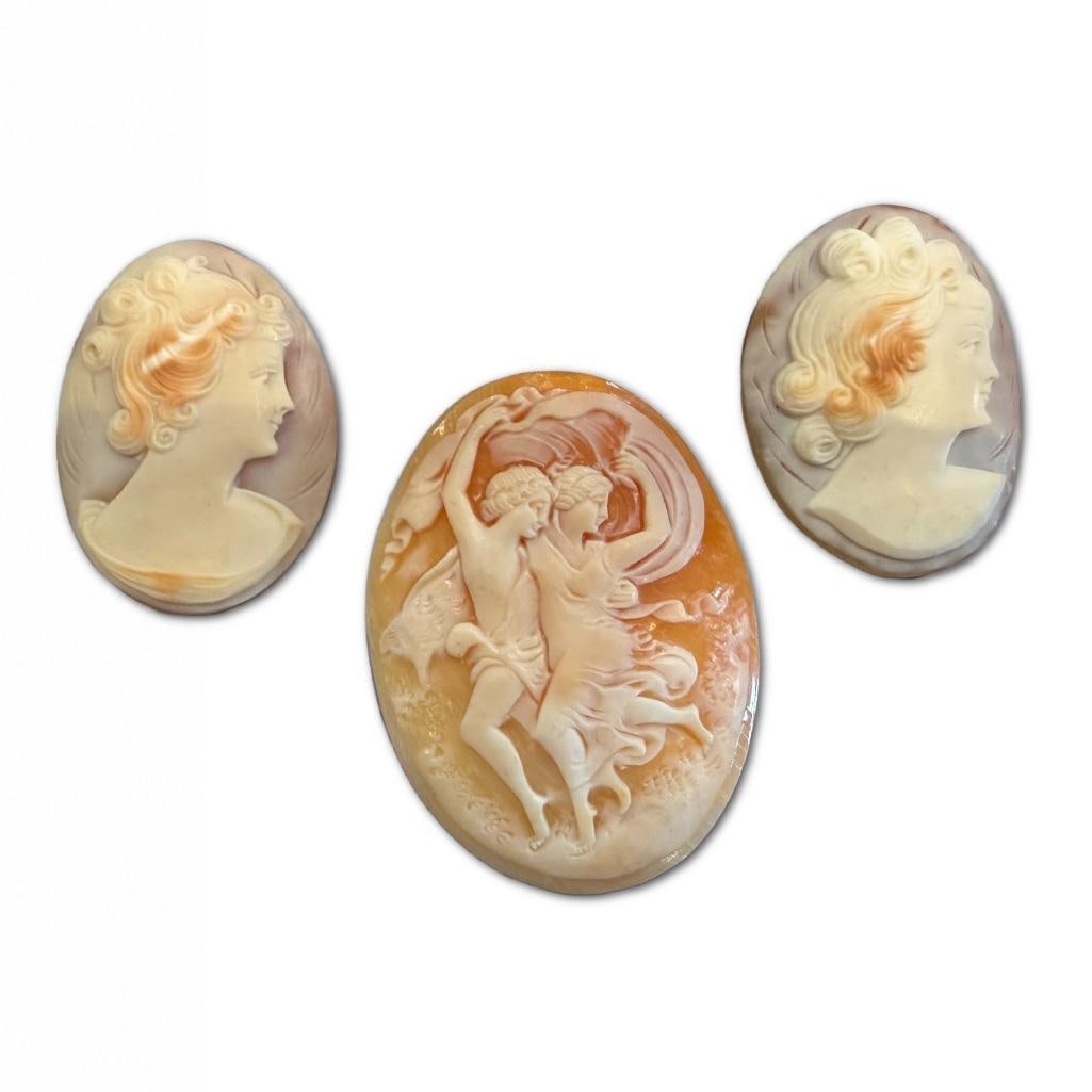 Collection of Three Antique Cameos: Collection of Three Antique Cameos The Larger Oval Cameo Measure inches 1.5 x 1.25 inches Approximately. The Smaller Pair of Matching Cameos Measure 1 x 1.25 inches Approximately.