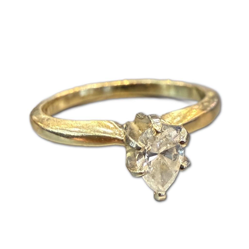 14k YG Pear Cut Diamond Solitaire Ring: 14k Yellow Gold Pear Cut Diamond Solitaire Ring Containing One (1) Marquis Cut Diamond Weighing Approximately .30cts in Carat Weight.The Diamond is Approximately SI in Clarity and H/I in Color. The