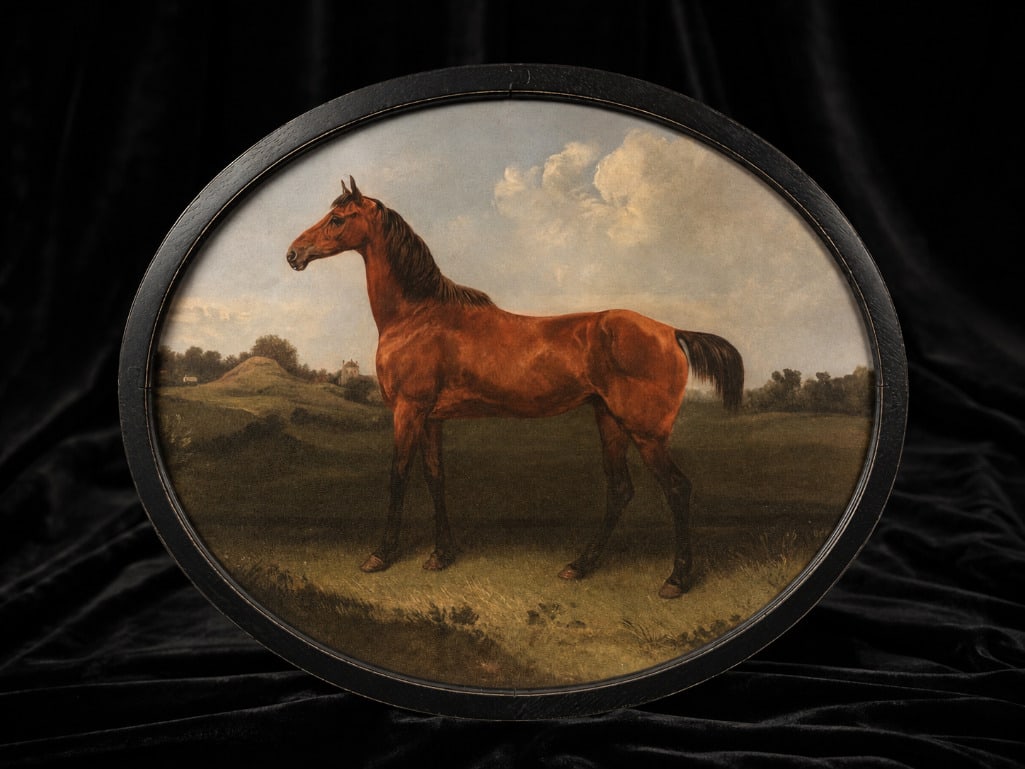 Round Framed Equestrian Portrait Print: Round Framed Equestrian Portrait Print. This lot includes one (1) framed oval east west print of a horse. The piece measures 24" x 20" framed and is in very good condition.