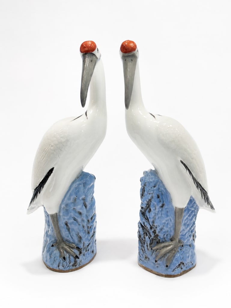 Pair of Vintage Chinese Export Porcelain Crane Figurines: Pair of Vintage Chinese Export Porcelain Crane Figurines. This lot includes two (2) porcelain crane figurines. They measure approximately 17.25" in height each and 6.25" in width/diameter at widest