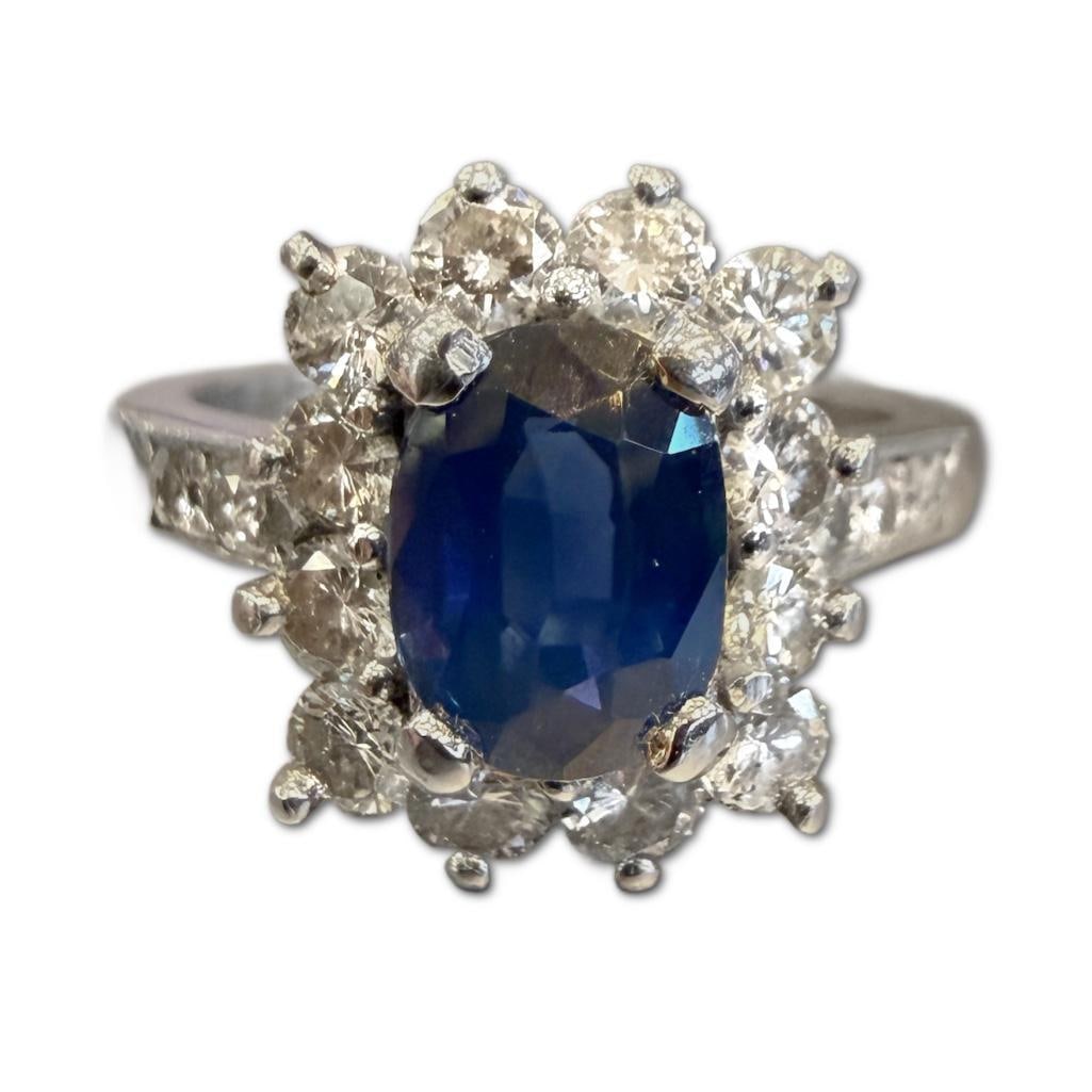 Platinum Sapphire & Diamond Ring: Platinum Sapphire & Diamond Ring Containing One (1) Oval Cut Sapphire Weighing Approximately 1.50cts in Carat Weight. The Ring Also Contains Eighteen Diamonds Weighing Approximately 1.38cts in Carat W