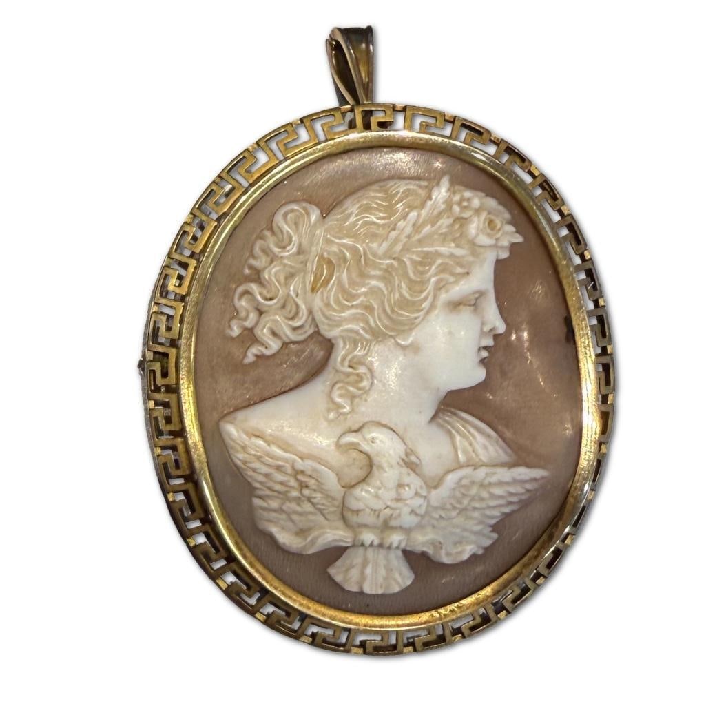 Antique 14k YG Antique Cameo Brooch: 14k Yellow Gold Antique Cameo Brooch Containing One Carved Cameo Piece Measuring Approximately 2 inches in Height and 1.75 inches in Width. The Cameo Features a Federal Style Eagle and Woman with a Gr