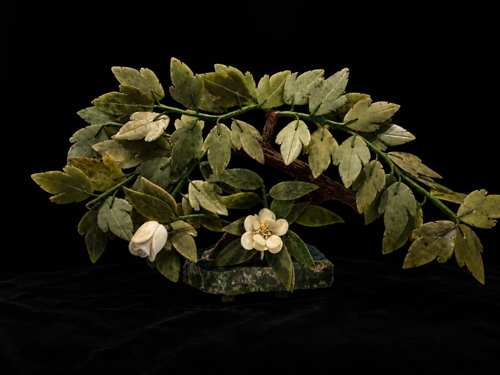 Chinese Carved Jade Bonsai Tree With Rosewood Base: This Lot Includes One (1) Jade Carved Stone Bonsai Tree With Rosewood Base. The Leafs are Hand-Carved from Serpentine, and Hand-Secured Using Silk Wrapped Wire. The Flowers are Calcite, Also Han