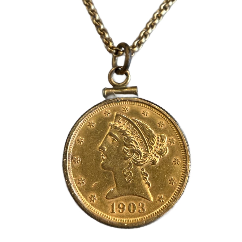 1903 Gold Liberty Head Necklace: 1903 Gold Liberty Head 5 Dollar Necklace Containing One (1) 1903 Gold Liberty Head 5 Dollar Coin on a 14k Yellow Gold 24 Inch Chain. The Chain by Itself Weighs 5.42dwt in Pennyweight.