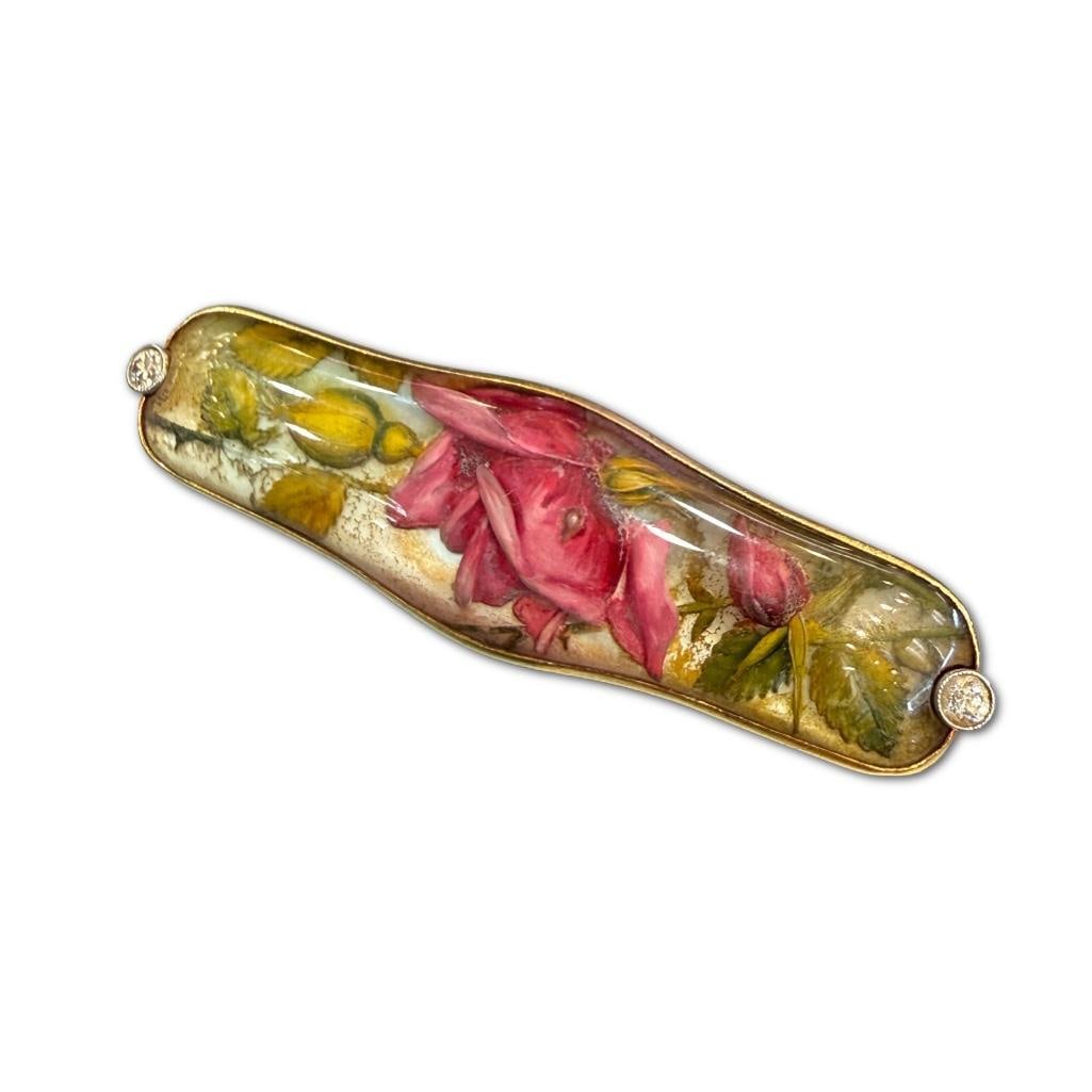 14k YG Antique Floral & Diamond Brooch: 14k Yellow Gold Antique Floral & Diamond Brooch Possibly from (1890-1910) With Crystal Dome and Reverse Carved Roses. The Pin Measures 2 x .5 inches. Provenance of Estate: The estate comes f