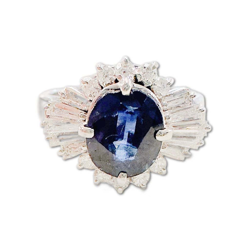 Platinum Natural Thailand Sapphire and Diamond Ring: Platinum Natural Thailand Sapphire and Diamond Ring. This Ring Includes One (1) Natural Oval Brilliant Faceted Cut Thailand Sapphire Corrundum (7.78 x 7.17 x 3.94mm), Weighing 2.10 Carats. The