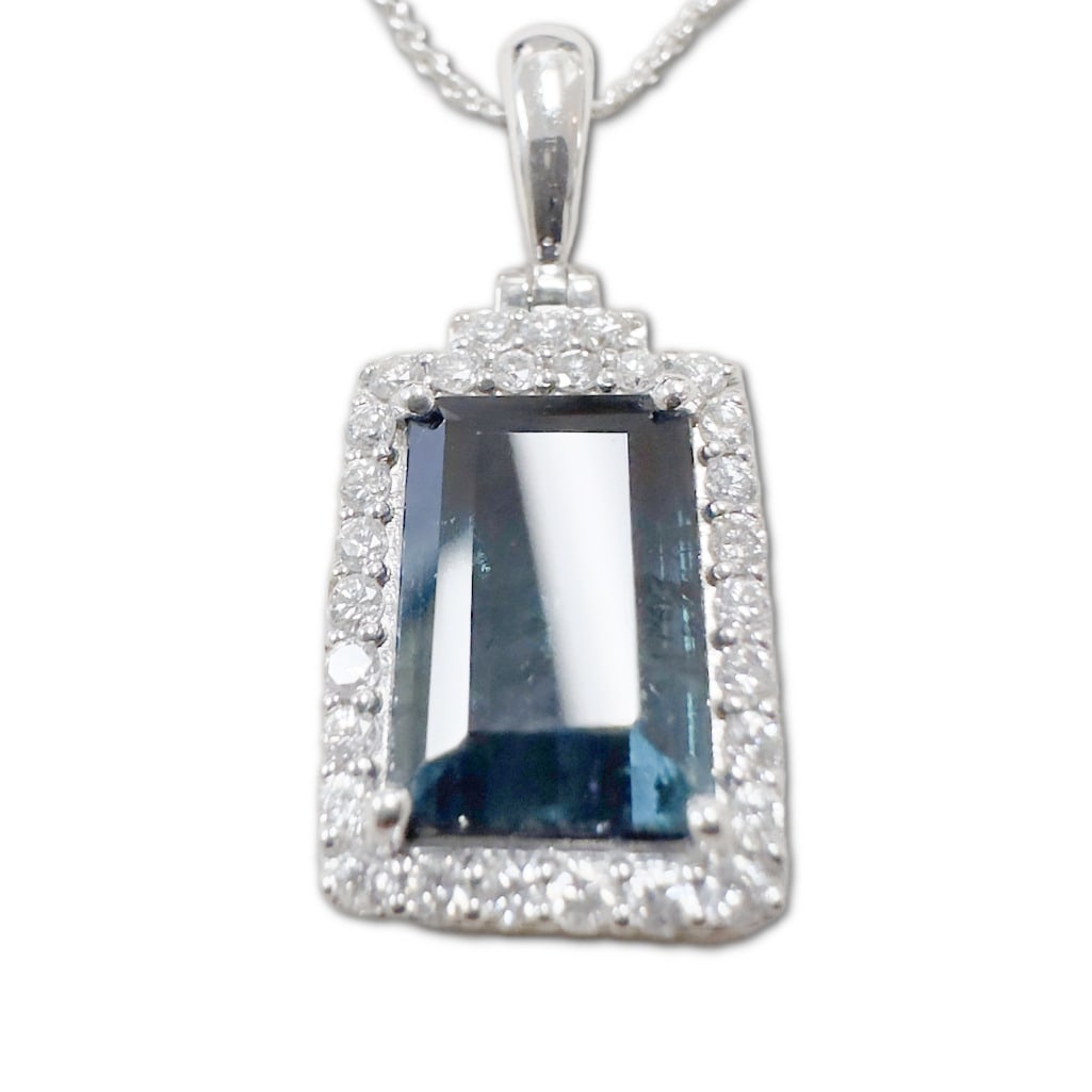 Platinum Natural Indicolite Tourmaline & Diamond Pendant w/ Chain: Platinum Natural Indicolite Tourmaline & Diamond Pendant w/ Chain. The Pendant Includes One (1) Natural Octagonal Step Faceted Cut Indicolite Tourmaline (10.18 x 6.86mm), Weighing 3.35 Carats. T