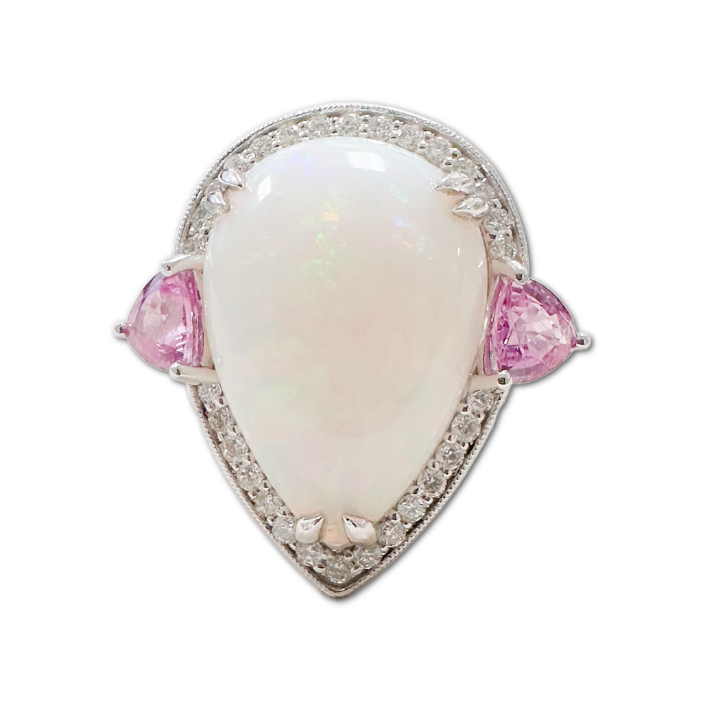Oscar Friedman Opal Sapphire & Diamond Ring: Oscar Friedman Opal Sapphire & Diamond Ring. This Ring Includes One (1) Pear Cabochon Natural Opal (19.2 x 10.3mm), Weighing 7.82 Carats. This Ring also Includes Two (2) Triangular Modified Brilliant 