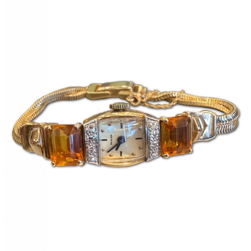 14k YG Retro Modern Paul Mercier Citrine & Diamond Wristwatch: 14k Yellow Gold Retro Modern Paul Mercier Citrine & Diamond Wristwatch Containing Two (2) Emerald Cut Citrine Weighing Approximately 12.80cts in Total Carat Weight. The Watch Also Contains Eight 