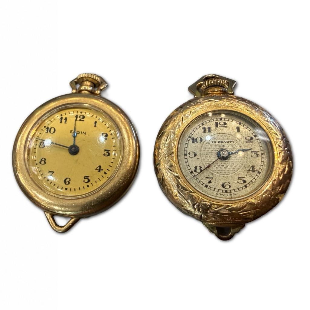 Two 14k Ladies Pocket Watch: Two 14k Ladies Pocket Watch. Elgin and UR Beauty. Both Watches Have a Diameter of Approximately 1 inch. 