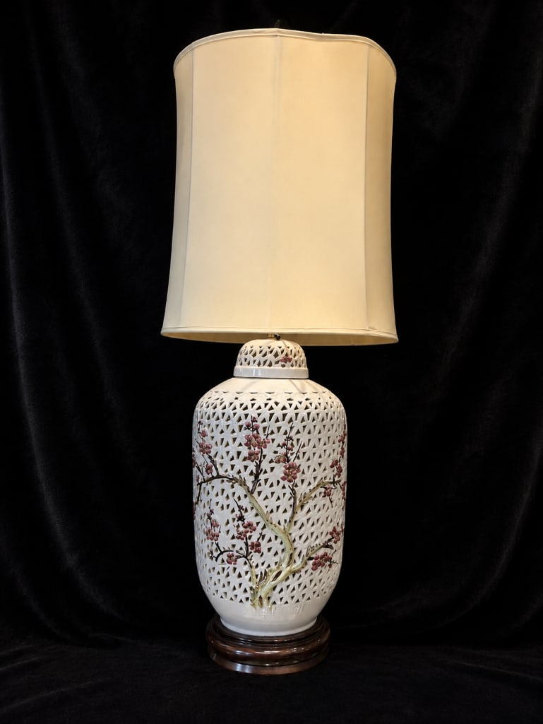 Mid-Century Chinoiserie Reticulated Ginger Jar Lamp: Mid-Century Chinoiserie Reticulated Ginger Jar Lamp. This lot includes one (1) mid-century Chinoiserie ginger jar lamp features a reticulated porcelain body intricately hand-painted with blooming cher