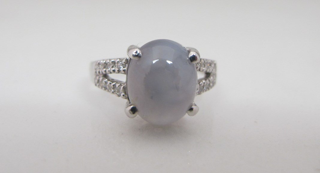 18KWG Star Sapphire & Diamond Ring: 18KWG Star Sapphire & Diamond Ring Containing 1 Star Sapph=7.60cts., 16Br=.22cts.