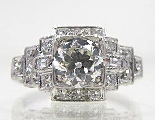 Art Deco Platinum Diamond Ring: Art Deco Platinum Diamond Ring Containing 1 Round Old European Cut Diamond=.75cts., Surrounded by 16 Full Cut and 2 Baguette Cut Diamonds