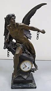 E. Picault La Pensee Brissant Ses Chaines Figural Clock: Cast Metal Patinated Figural Clock, Depicting a Winged Figure on a Rock, Titled on Base, ''La Pensee Brisant Ses Chaines'' signed E. Picault (Emile Louis Picault, French 1833-1915), eight day time and