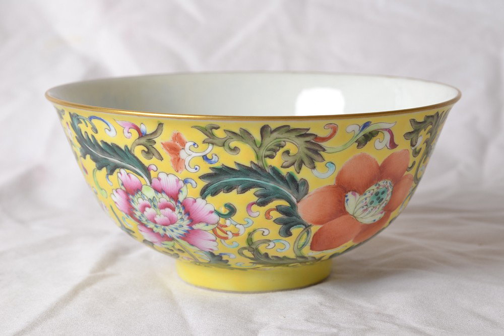 FAMILLE ROSE PORCELAIN BOWL: Interior with red bats, exterior with colorful flowers. Qianlong mark in red. 2.675" H x 5.5" DIA.