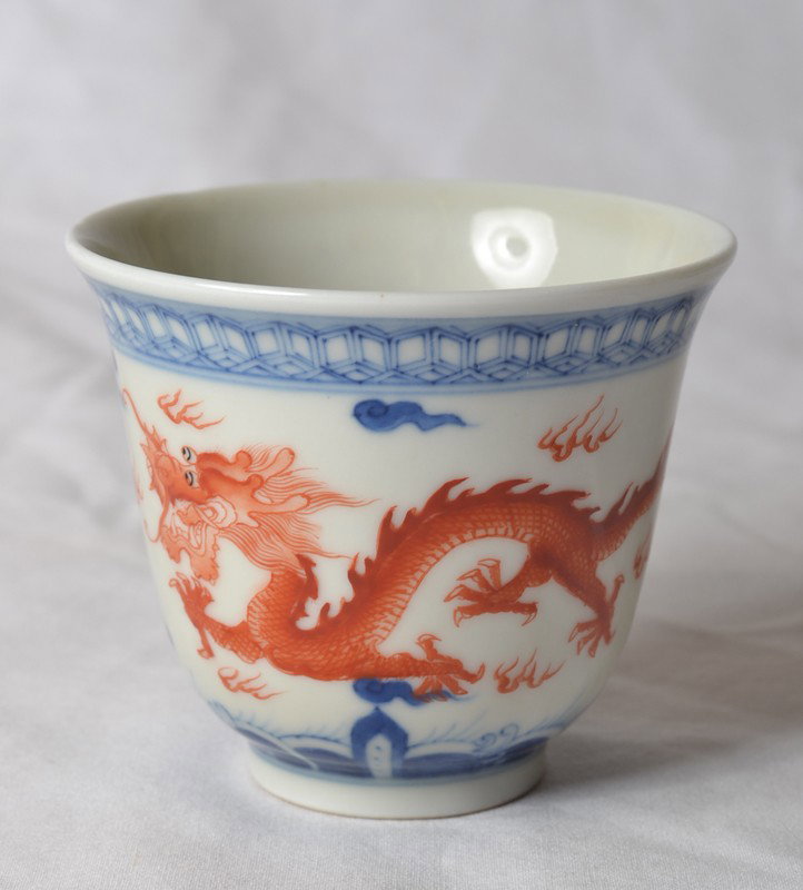 RED & BLUE DRAGON CUP: With dragons chasing a flaming pearl on outside, inside with bats and Shou symbol. Six character blue mark. 2.75" H x 3.25" DIA.