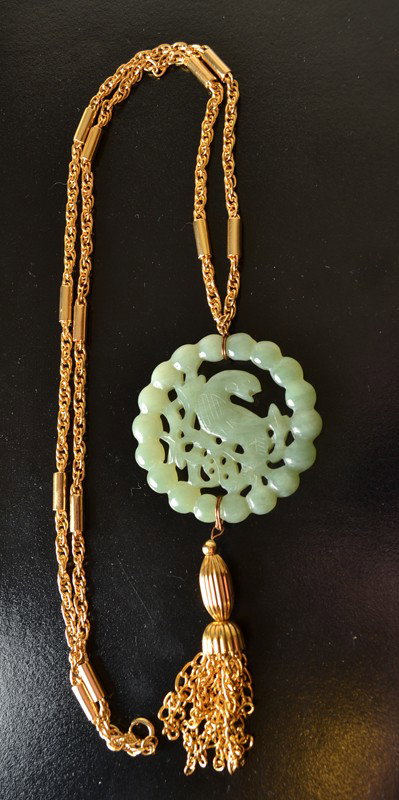 JADE SACHOW: Both sides carved with bird and beadings attached to gold plated necklace with tassels. 20.5" L.