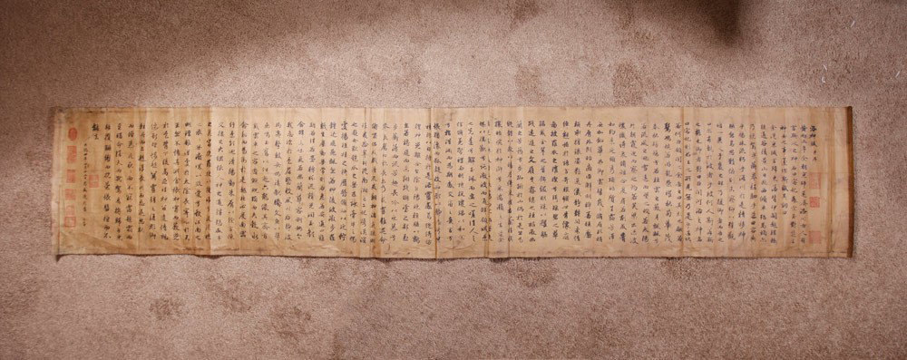 CHINESE CALIGRAPHY BY ZI ANG: Painted with caligraphy and numerous seal marks. 34.75" H x 12.5" W.