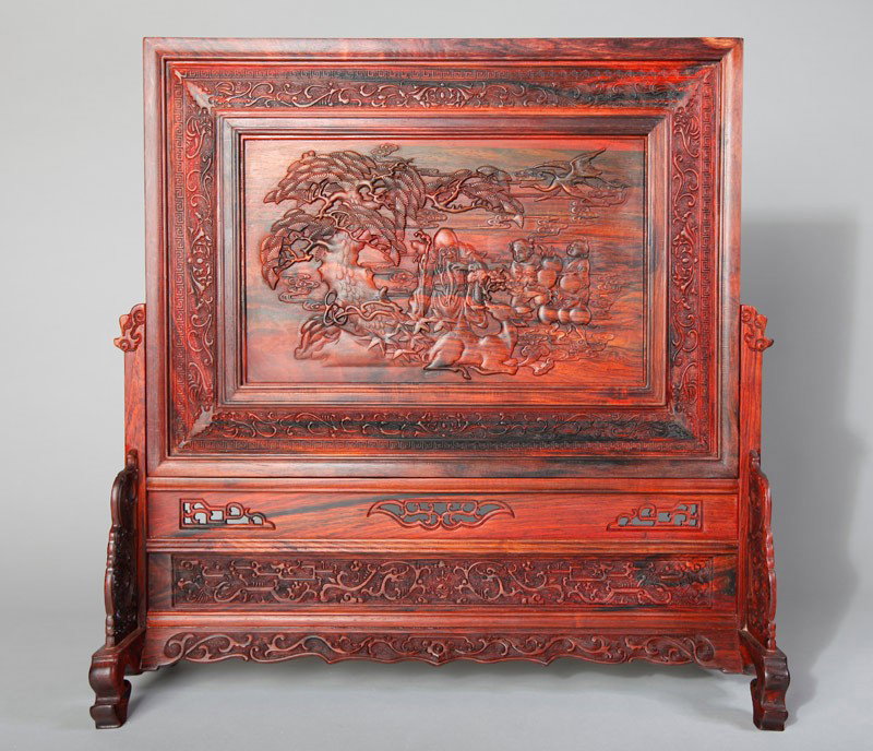 CHINESE CARVED HARDWOOD TABLE SCREEN: One side carved with caligraphy and bats, the reverse carved with God of Longevity and children, with scroll carvings surrounding, the same scroll carvings on bottom with some openwork. 16.625" H x 16