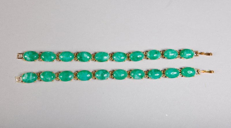 PAIR OF CUI JADE BRACELETS: 10 oval beads, 6.75' L.
