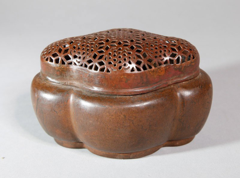 CHINESE COPPER HAND WARMER: Cartouche shape with openwork floral lid. Two character etched mark. 4" L.