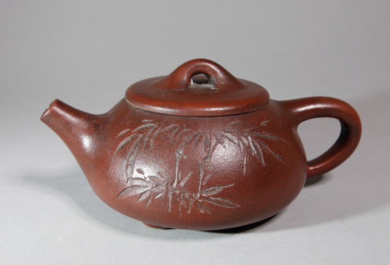 CHINESE ZI SHA TEA POT: Carved bamboo to each side. Three character carved mark with additional two small carved marks. 7.125" L.